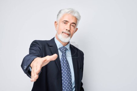 Photo for Portrait of confident businessman in suit chooses you points finger at camera isolated on white studio background. Welcome gesture, join our team concep - Royalty Free Image