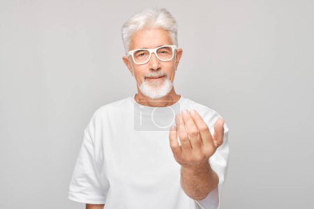 Photo for Portrait of confident adult man in white clothes chooses you finger points at camera isolated on white studio background. Welcome gesture, join our team concept - Royalty Free Image