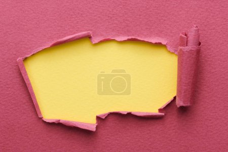 Photo for Frame of ripped paper with torn edges. Window for text with copy space yellow burgundy red colors, shreds of notebook pages. Abstract backgroun - Royalty Free Image