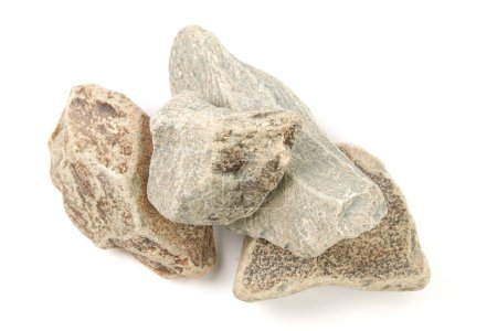 Foto de Conjunto de piedras de sauna aisladas sobre fondo blanco. Piedra mineral natural porfirita - Imagen libre de derechos