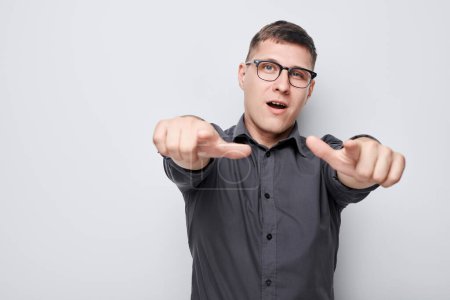 Photo for Portrait of confident man chooses you points finger at camera isolated on white studio background. Welcome gesture, join our team concep - Royalty Free Image