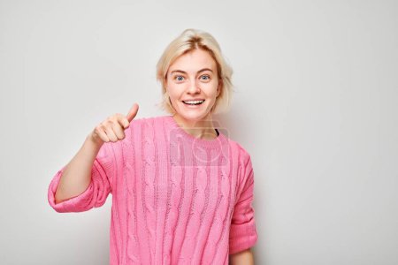 Photo for Portrait of confident girl chooses you points finger at camera isolated on white studio background. Welcome gesture, join our team concept - Royalty Free Image