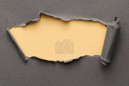 Photo for Frame of ripped paper with torn edges. Window for text with copy space grey beige colors, shreds of notebook pages. Abstract backgroun - Royalty Free Image
