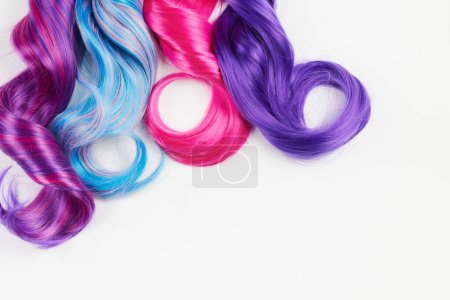 Photo for Natural looking shiny hair of different bright colors, cosplay wig on a white background - Royalty Free Image
