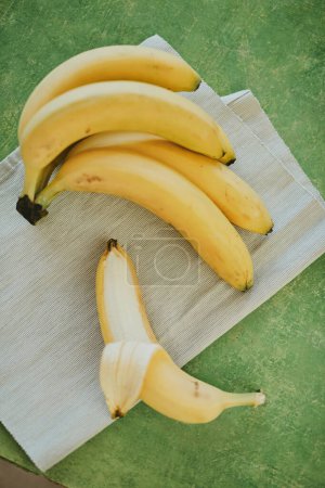 Photo for Close-up of bananas on green background - Royalty Free Image