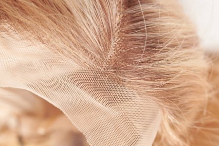 Photo for Natural looking blonde wig close-up details, natural hair, extension system - Royalty Free Image