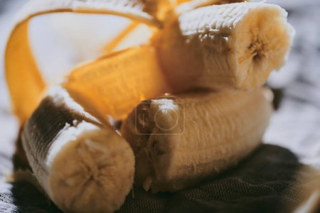 Photo for Close-up of peeled bananas on a dark background - Royalty Free Image