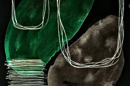 Foto de Fondo abstracto negro y verde. Coloridas manchas de tinta y manchas, papel pintado de impresión. Fondo creativo, pinceladas caóticas, patrón para imprimir en el coche - Imagen libre de derechos