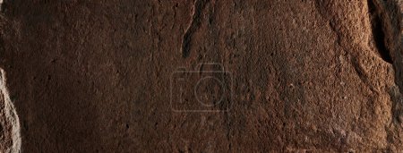 Photo for Brown stone texture, dark abstract background. Natural mineral rock close up details, empty backdrop with copy space for design - Royalty Free Image