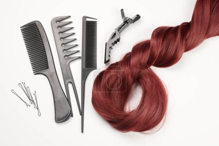 Photo for Hairdresser tools close-up isolated on white background. Hair curls and set of combs, clips, hairpins, hair beauty salon concept - Royalty Free Image