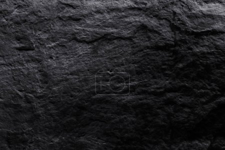Foto de Textura de piedra negra, fondo abstracto oscuro. Piedra mineral natural cerca de los detalles, fondo vacío con espacio de copia para el diseño - Imagen libre de derechos