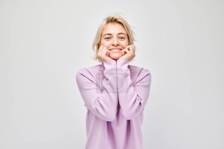 Photo for Portrait blond young woman smiling joyfully touching happy shocked face isolated on white studio background, advertising banne - Royalty Free Image