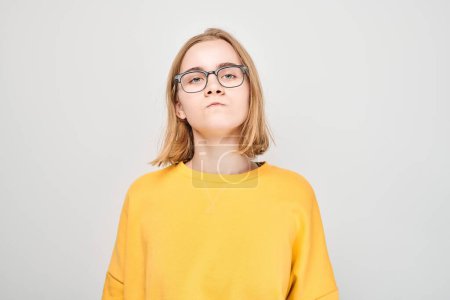 Photo for Portrait of student girl with sad face offended and crying on white background. Nerves, stress, uncertainty concep - Royalty Free Image