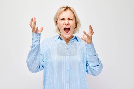 Photo for Portrait of girl screaming with anger, freaking out, breakdown on white background. Depression, uncertainty, nervous stress concep - Royalty Free Image