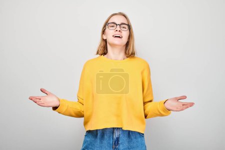 Photo for Portrait of tired student girl with sad face feeling emotional burnout on white background. Nerves, stress, uncertainty concep - Royalty Free Image