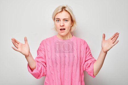 Portrait of girl screaming with anger, freaking out, breakdown on white background. Depression, uncertainty, nervous stress concep