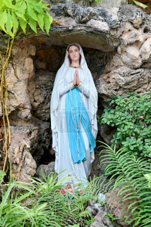 Photo for Statue of Our lady of grace virgin Mary view with natural background in the rock cave at Thailand. selective focus. - Royalty Free Image