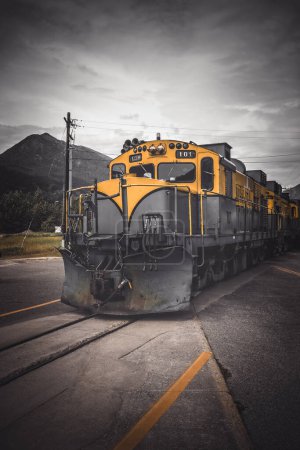 Colorful yellow and black locomotive in Alaska