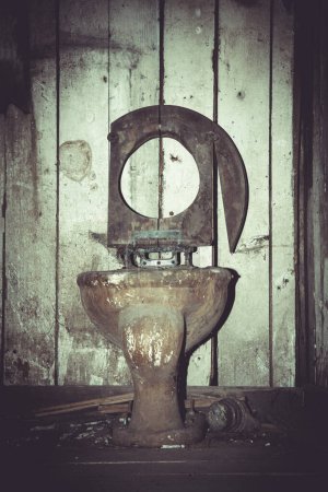 Old and broken toilette in an abandoned basement