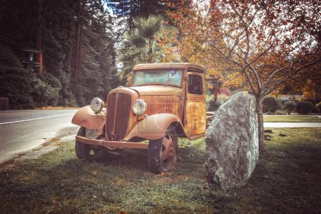 Photo for Old rusty truck besides a street - Royalty Free Image