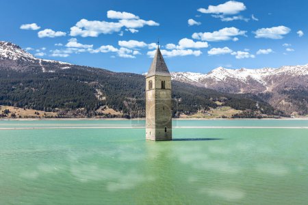 The famous bell. tower in the Lake Reschen, Passo di Resio, Italy