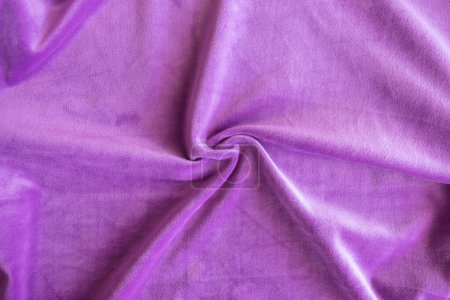 Tejido de textura de punto lila. Fondo de tela púrpura. Material suave para ropa de moda.