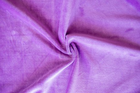Tejido de textura de punto lila. Fondo de tela púrpura. Material suave para ropa de moda.