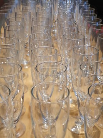 Empty glasses of champagne on the bar table in restaurant.
