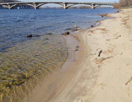 The bank of the Dnipro River, a wild sandy beach in the Hydropark