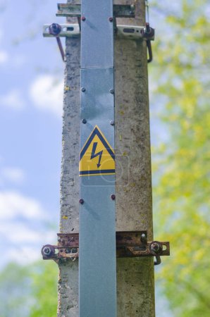 Warning High Voltage Electrical Sign on High Voltage Pole. High quality photo