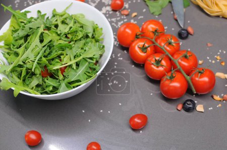 Fresh tomatoes in a plate on a dark background. Harvesting tomatoes. Top view. High quality photo