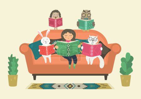 Mädchen liest Buch mit Fantasietieren auf Sofa