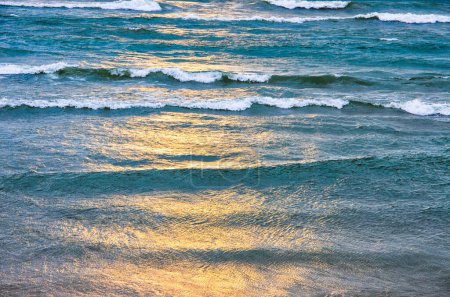 Photo for Sunset over lake, waves, ocean, beach, glistening water, ocean sunset, great lakes - Royalty Free Image