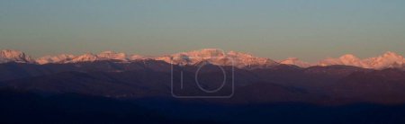 snowy mountain range of the Pyrenees in winter at sunrise