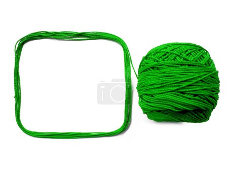 Photo for Background of wool yarn, knitted yarn, can also be used as a yarn frame. Green knitting yarn for handicrafts isolated on white background - Royalty Free Image