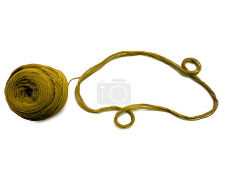 Photo for Background of wool yarn, knitted yarn, can also be used as a yarn frame. Yellow knitting yarn for handicrafts isolated on white background - Royalty Free Image