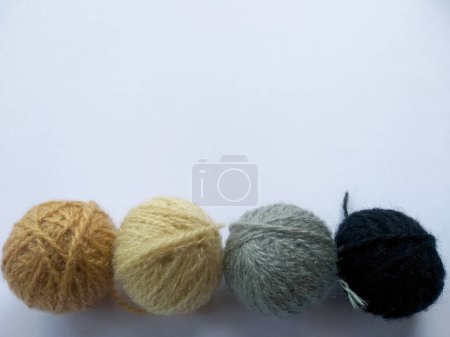 Téléchargez les photos : Background of wool yarn, knitted yarn, can also be used as a yarn frame. Knitting yarn for handicrafts isolated on white background - en image libre de droit