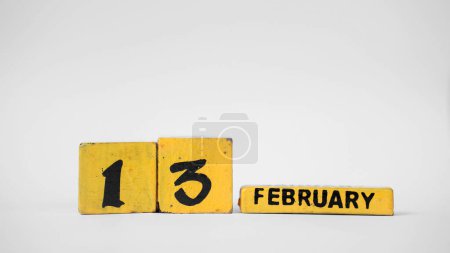 FEBRUARY 13 Wooden calendar. World Radio Day. White background with space for your text.