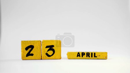 APRIL 23 Wooden calendar. World Book and Copyright Day. White background with space for your text.