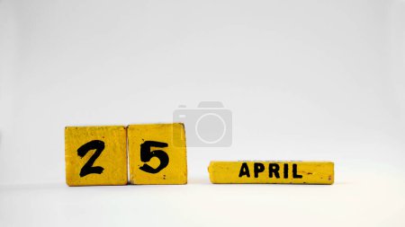 APRIL 25 Wooden calendar. World Malaria Day. International Delegates Day. White background with space for your text