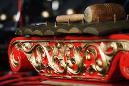 Red Javanese Gamelan. Traditional musical instruments from Indonesia. The frame was wood painted red, the blade was made of bronze