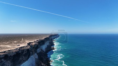Aerial view of the Great Australian Bight and a jet contrail