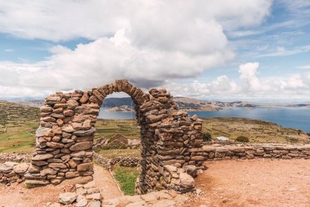 stone arch on top of a mountain on the island of amantani in puno peru on lake titicaca