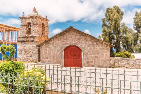 church with bell tower in the plaza de amantani on lake titicaca in puno peru in the andes mountain range