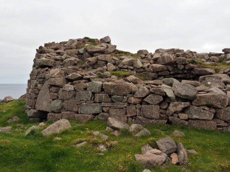 Broch of Culswick. Mainland, Shetland Islands. Culswick Broch is an unexcavated coastal broch in Mainland, in the Shetland Islands. Scotland. The monument comprises a broch of Iron Age date, built probably between 500 BC and AD 200. 