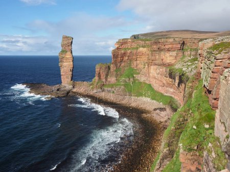 The Old Man of Hoy, a sea stack on Hoy, Orkney Islands. The Old Man of Hoy is a 449-foot (137-metre) sea stack on Hoy, part of the Orkney archipelago off the north coast of Scotland. It is one of the tallest stacks in the United Kingdom. 