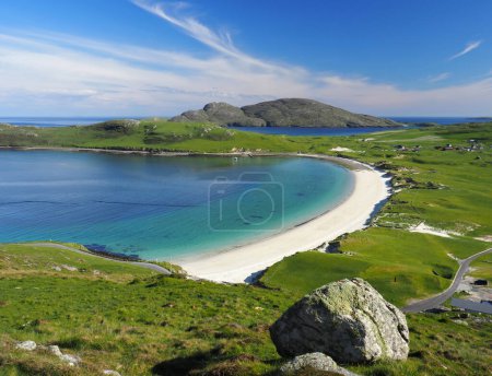 Photo for Vatersay, a stunning beach in the Isle of Barra. Outer Hebrides. Scotland. Vatersay Bay is a beautiful sandy bay with a wide expanse of sand dunes. Vatersay, south of the isle of Barra, is the most southerly inhabited island of the Outer Hebrides. - Royalty Free Image