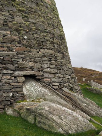 Photo for Dun Carloway broch.  Isle of Lewis, Scotland. It is a remarkably well preserved broch, situated in the Outer Hebrides. Dun Carloway was probably built in the 1st century AD. - Royalty Free Image