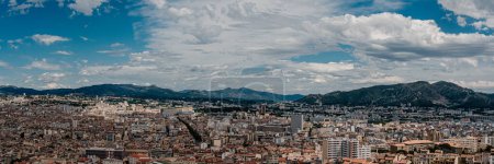 Panoramic view of Marseille with mountains and dynamic sky