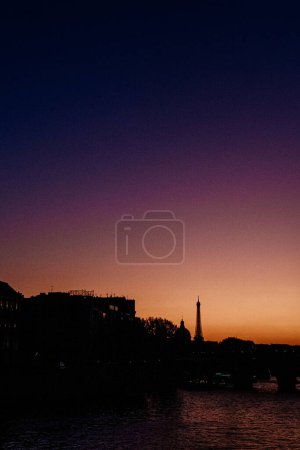 Silhouette of Paris skyline with Eiffel Tower at sunset
